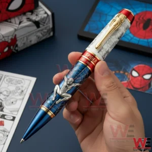 Hand holding a superhero pen with blue web design red gold accents and character artwork in a comic themed background.