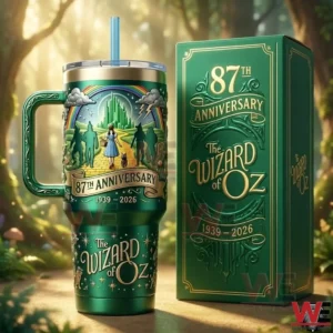 The Wizard of Oz 87th Anniversary Commemorative Tumbler 3 Green fantasy metal tumbler with matching box displayed on a forest path with warm magical lighting!