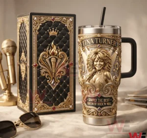 Tina Turner themed insulated tumbler with ornate gold design and matching collector box displayed on a refined tabletop!