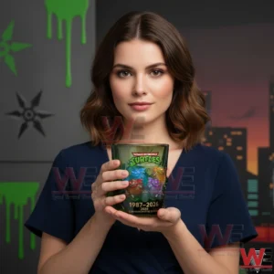 Woman holding a themed collectible glass in front of a modern background!
