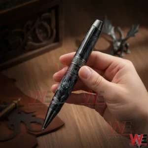 Hand holding a Toothless themed collectible pen with detailed dragon artwork on a wooden surface!