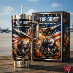 Top Gun Maverick 40Th Anniversary 1986-2026 Yeti Tumbler 4 Top Gun 40th Anniversary tumbler with handle and straw beside matching box featuring fighter jet American flag flames Maverick helmet and 1986 2026 text with an airfield background!