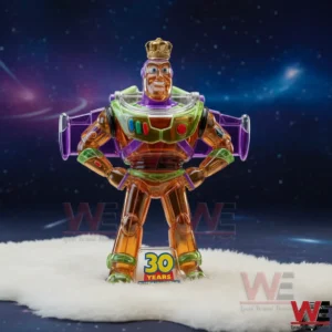 A transparent orange space themed collectible figure with colorful suit details and a golden crown displayed on a white surface with a starry cosmic background and a thirty years anniversary base!