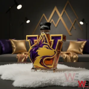 Decorative whiskey bottle with Washington Huskies themed design in purple and gold displayed on a white surface in a modern room!