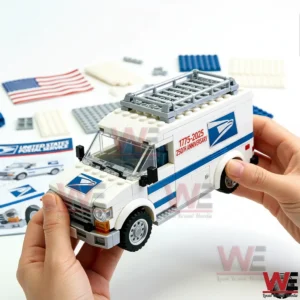 Hands holding a white and blue postal delivery van building block model with anniversary graphics on a bright white background with building pieces and decals nearby!