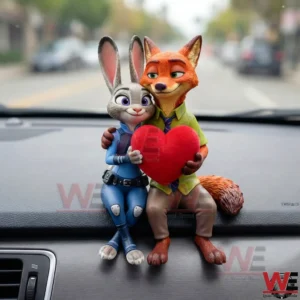 Fox and rabbit couple figurine holding a red heart sitting on a car dashboard with a soft blurred street background!
