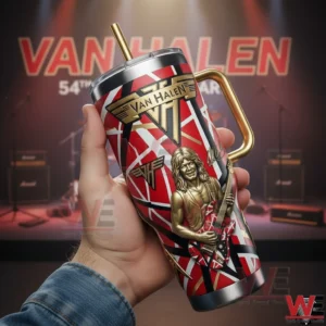 Hand holding a Van Halen anniversary insulated tumbler with handle straw and guitarist design on a stage background!