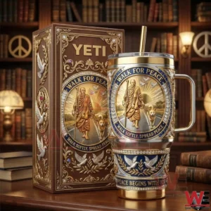 A high end stainless steel tumbler with handle and straw placed next to an elegant box decorated with peace themed artwork bookshelves and warm lighting!