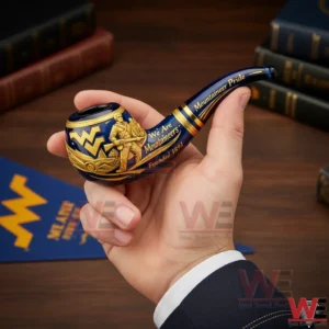 West Virginia Mountaineers 135th Anniversary Pipe 3 Hand holding a West Virginia Mountaineers commemorative pipe featuring blue gold accents detailed artwork and pride lettering.