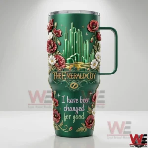Studio view of a green fantasy themed handled tumbler with emerald city design and floral details!