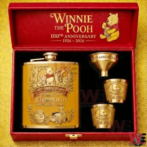 Winnie the Pooh one hundredth anniversary flask gift set displayed open with a gold decorated flask and matching cups inside a red box!