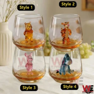 Set of Winnie the Pooh character glasses featuring multiple cute designs arranged neatly on a bright tabletop!