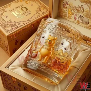 Winnie the Pooh anniversary glass placed in a luxury presentation box with detailed character illustration warm golden hues and a classic story inspired style!