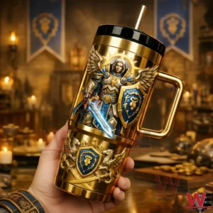 Hand holding a gold World of Warcraft Alliance paladin stainless steel tumbler with handle and straw featuring an armored warrior with sword and shield in a warm medieval tavern setting!
