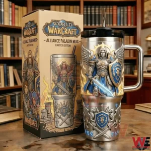 Stainless World Warcraft Alliance Paladin handled tumbler with straw beside a matching limited edition box on a table in a library background!