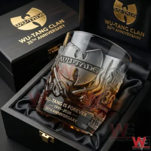 A clear whiskey glass showcasing Wu Tang Clan thirty five year anniversary design placed securely inside an elegant luxury display case!