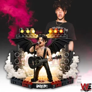 Yungblud building block stage figure with bat wings speakers lighting and artistic background highlighting rock identity!