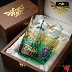 Zelda 40th Anniversary Skyward Legacy Whiskey Glass 5 Zelda anniversary whiskey glass displayed inside a wooden box with white fabric and detailed fantasy design!