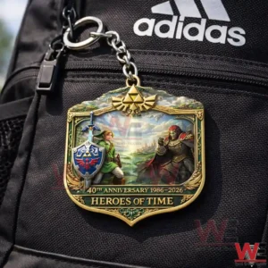 Heroes of Time Zelda keychain attached to a black backpack showing ornate artwork and 40th anniversary 1986 2026 text!