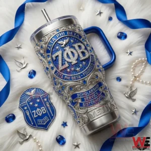 Metal tumbler with blue decorative details placed on a soft white surface with coordinated elegant accessories!