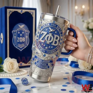 Hand holding an elegant blue and silver metal tumbler displayed beside a luxury gift box in a formal setting!