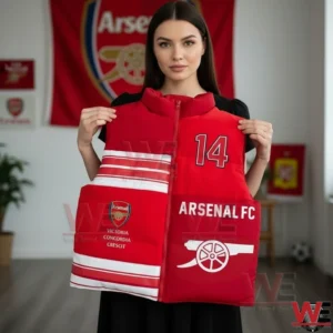 Arsenal Sleeveless Puffer Vest 3 Woman holding a red sleeveless Arsenal puffer vest with club graphics!
