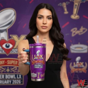 Woman holding a purple Super Bowl Bad Bunny themed tumbler in front of a branded backdrop!