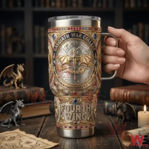 Hand holding Basgiath War College Fourth Wing tumbler with dragon emblem in library.
