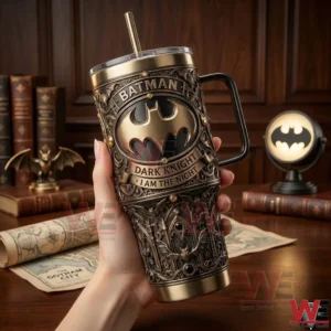 Hand holding Batman Dark Knight tumbler in classic study room!