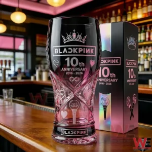 Blackpink tenth anniversary pink and black commemorative glass on a bar counter with matching box!
