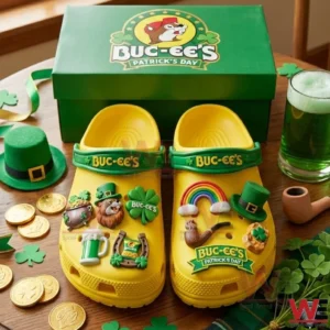 Yellow Buc ees clogs with Patrick Day charms displayed on a festive table with green decorations!