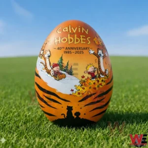 Decorative Calvin and Hobbes themed egg standing on green grass outdoors!