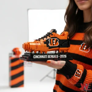 A brick built Cincinnati Bengals football shoe displayed on a stand in a studio setting!