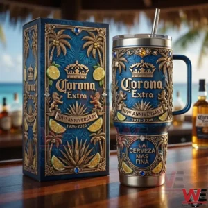 Decorative Corona Extra insulated tumbler with ornate blue and gold design next to its box on a wooden bar!