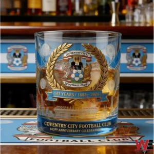 Coventry City Football Club commemorative whiskey glass filled with whiskey on a bar counter!