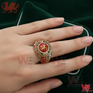 Hand wearing gold ring with red dragon and Cymru engraving!