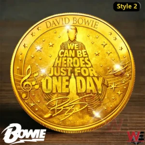 Gold commemorative coin displaying the We Can Be Heroes message with a symbolic figure and musical space themed design!