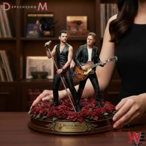 Resin figurine of Depeche Mode members standing on a base of red roses!