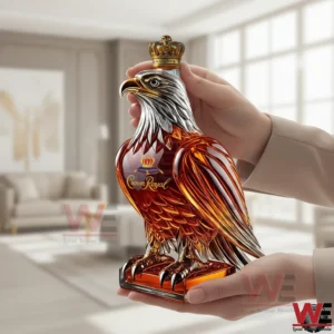 Eagle shaped whisky bottle with crown stopper held in hands!