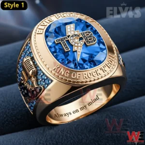 Gold ring with blue gemstone and TCB emblem honoring Elvis Presley.