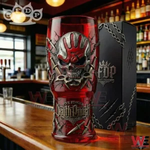 Red bar glass with skull and hand design displayed on a wooden counter!