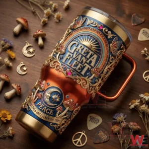 Greta Van Fleet tumbler with ornate design surrounded by guitar picks and dried flowers.