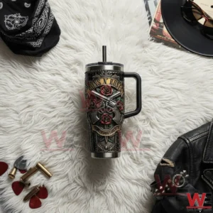 Guns N Roses Live Loud Forever tumbler with revolvers and red roses design on white fur background.