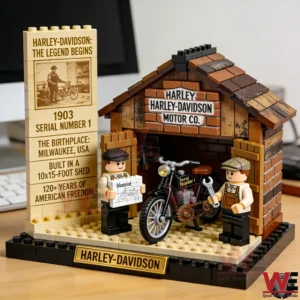 Brick model of a 1903 Harley Davidson workshop with a small motorcycle and two builders inside a wooden shed.