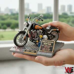 Hands holding a building brick Harley Davidson Softail model on a small display base!