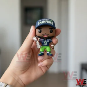 Hand holding Seattle Seahawks Super Bowl LX Champions Kenneth Walker III MVP figure indoors!