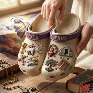 Hands holding Jesus themed crocs with religious items!