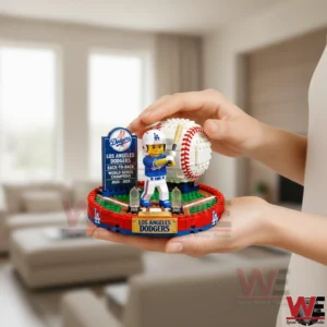 Hands holding a brick built Los Angeles Dodgers back to back World Series champions display in a living room.