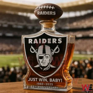 Raiders anniversary whiskey decanter with football shaped stopper displayed in front of a stadium!
