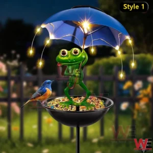 Frog holding umbrella with LED lights above a bird feeder bowl at night.